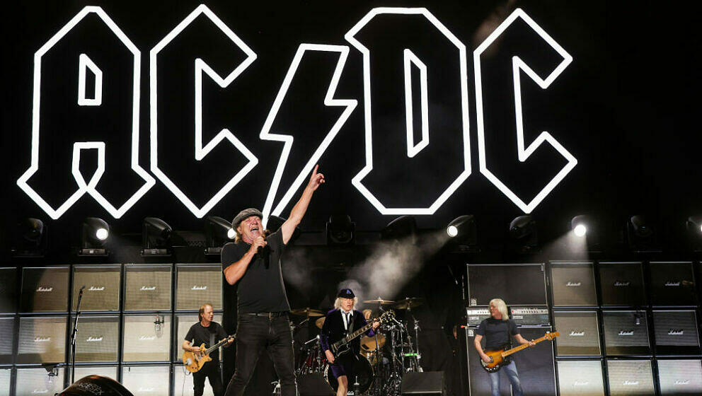 INDIO, CALIFORNIA - OCTOBER 07: (EDITORIAL USE ONLY) (L-R) Stevie Young, Brian Johnson, Angus Young, and Cliff Williams of AC