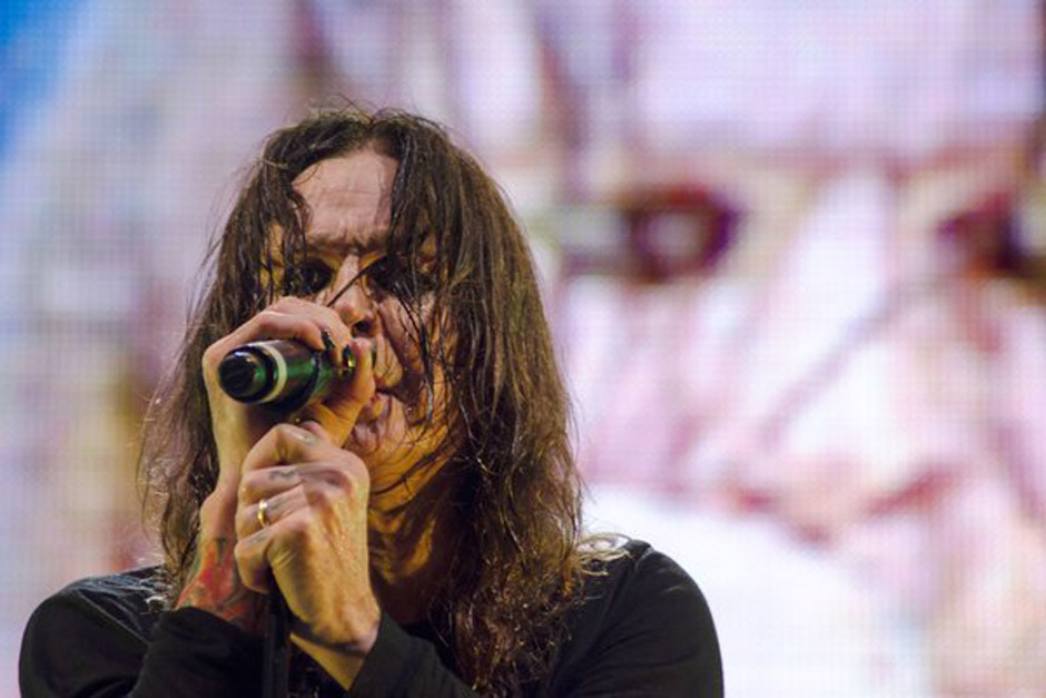 Musician Ozzy Osbourne, lead singer of British band Black Sabbath during concert of their world tour, 'The Reunion Tour', in 