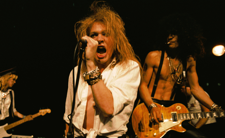 LOS ANGELES - SEPTEMBER 28:  (L-R) Duff McKagan, Axl Rose and Slash of the rock group 'Guns n' Roses' perform at the LA Stree