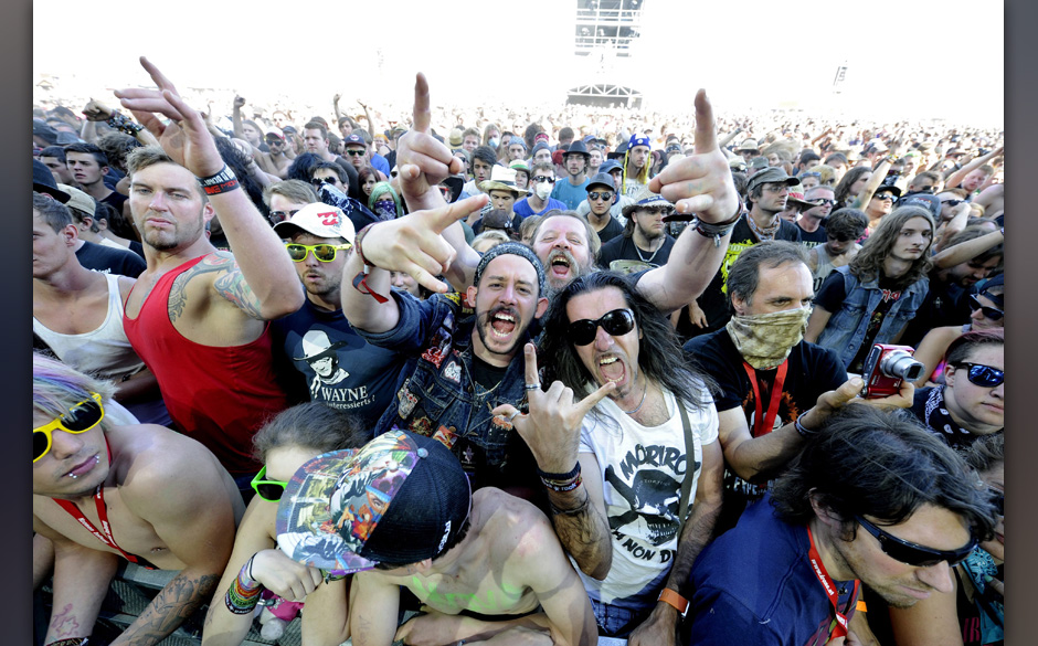 epa04254066 Fans cheer in front of the Blue Stage during a concert at the Nova Rock 2014 festival in Nickelsdorf, Austria, 13