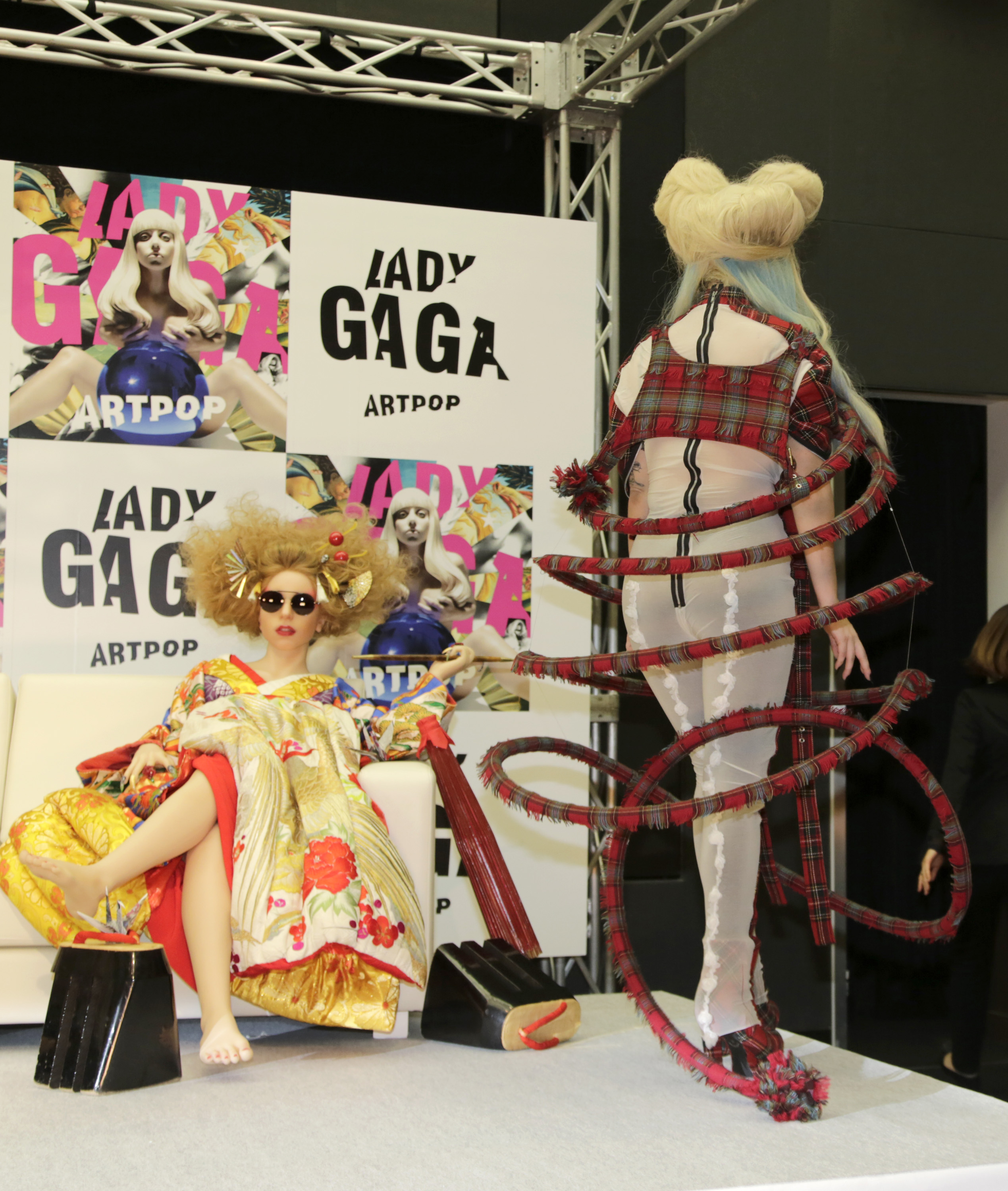 Lady Gaga leaves after a press conference to promote her album 'ARTPOP' in Tokyo, Sunday, Dec. 1, 2013. (AP Photo/Shizuo K...