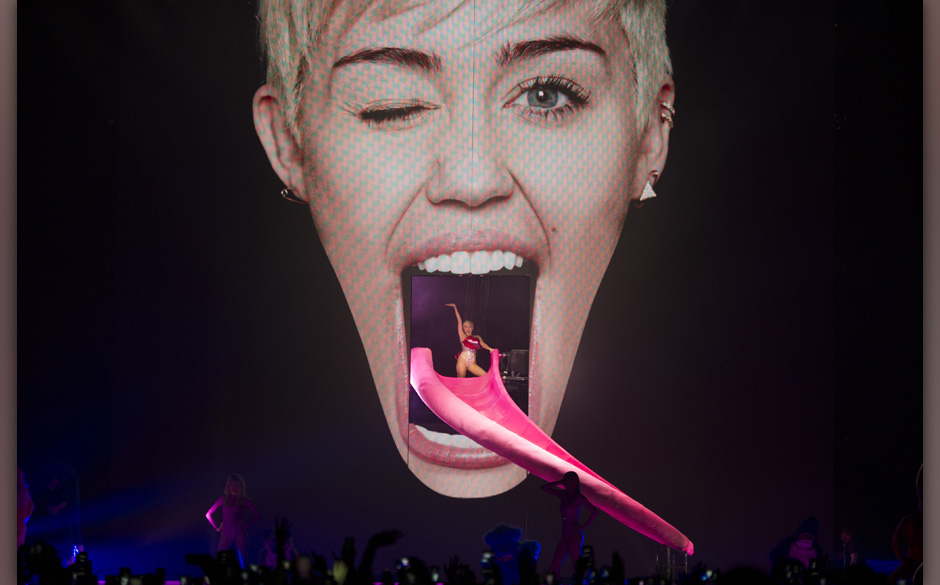 In this picture made available on Tuesday, May 27, 2014, US singer Miley Cyrus performs during a concert in Cologne, Germany,