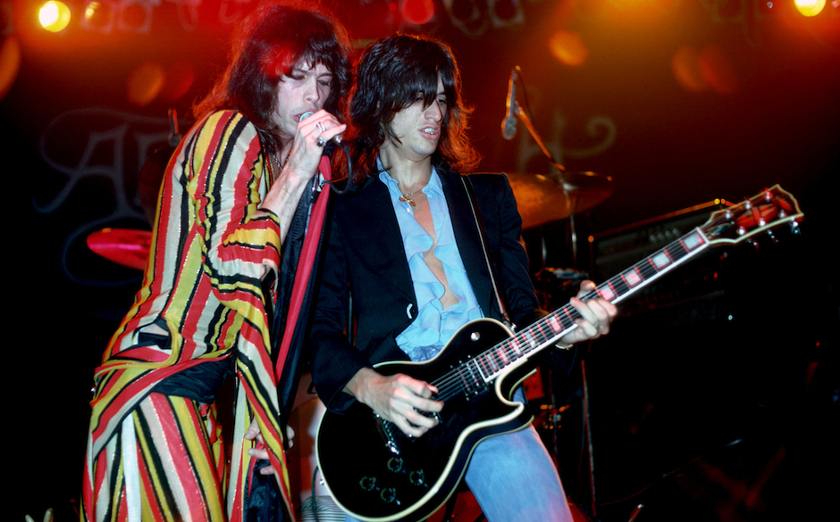 UNITED STATES - DECEMBER 01:  Photo of AEROSMITH; Steven Tyler and Joe Perry (playing Gibson Les Paul guitar) performing live