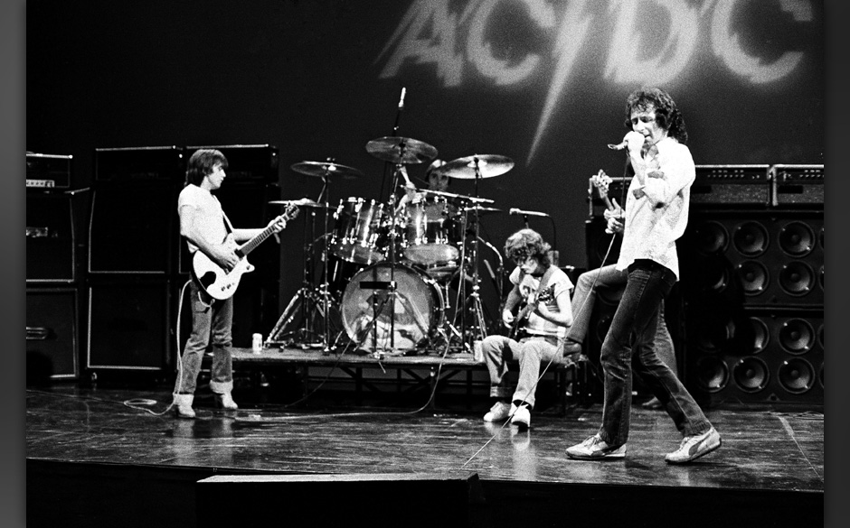 HOLLYWOOD - CIRCA 1977:  Rhythm guitarist Malcolm Young, drummer Phil Rudd, lead guitarist Angus Young, and singer Bon Scott 