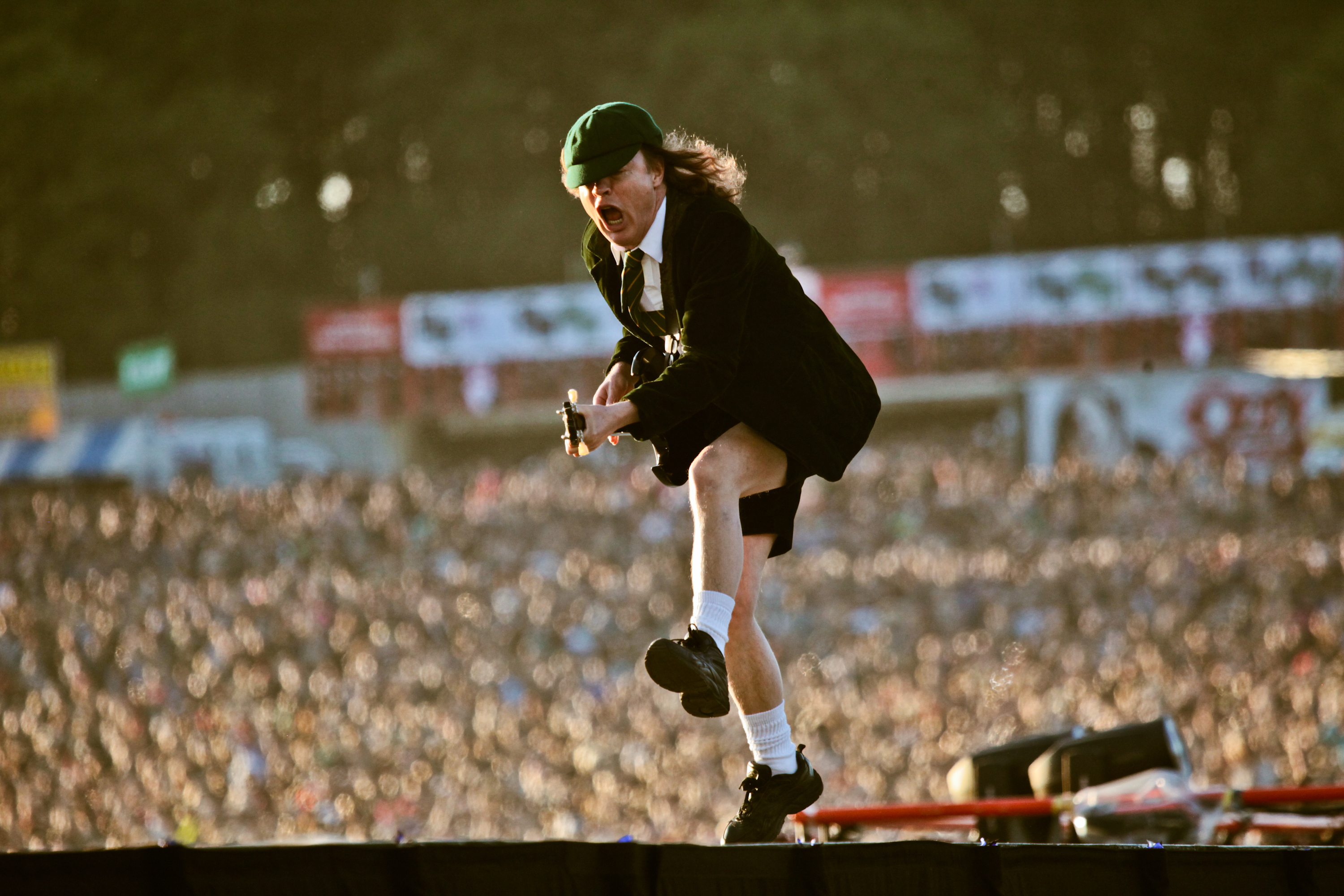 DONINGTON, UK - JUNE 11: A view from the stage showing the audience as Angus Young of AC/DC performs on stage at Download Fes