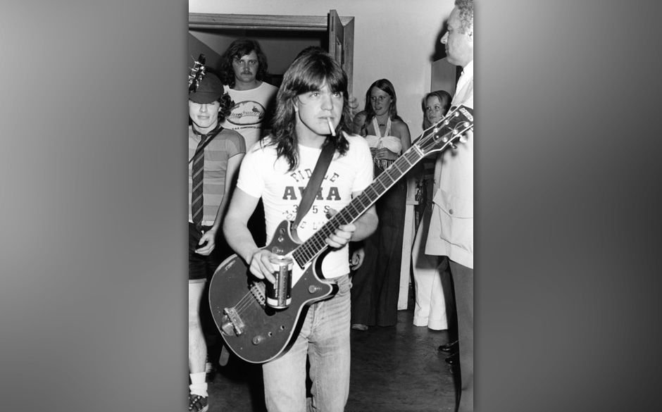 AUSTRALIA - JANUARY 01:  Photo of AC/DC and Malcolm YOUNG and Angus YOUNG; Malcolm Young and Angus Young (behind) backstag...