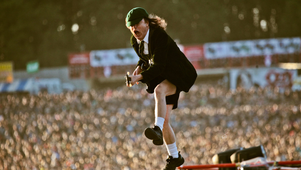 DONINGTON, UK - JUNE 11: A view from the stage showing the audience as Angus Young of AC/DC performs on stage at Download Fes