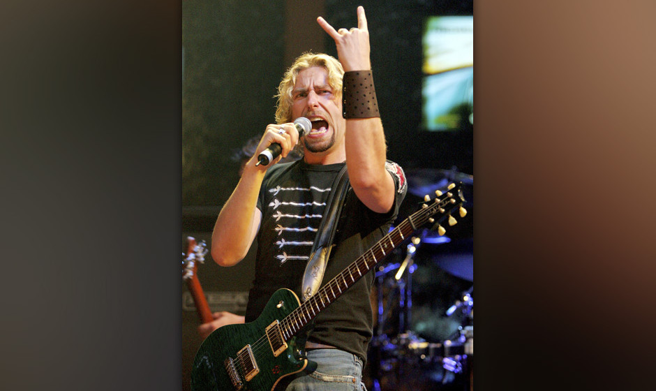 LAS VEGAS - AUGUST 25:  Nickelback frontman Chad Kroeger talks to the sold-out crowd as he performs at the Rain Nightclub ins