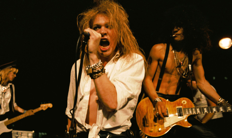 LOS ANGELES - SEPTEMBER 28:  (L-R) Duff McKagan, Axl Rose and Slash of the rock group 'Guns n' Roses' perform at the LA St...