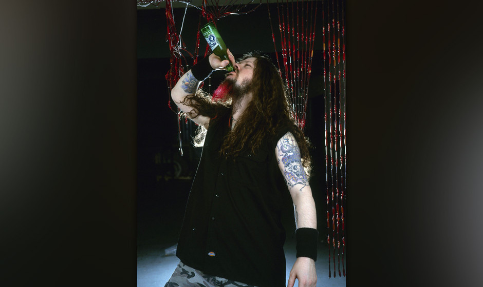 UNITED KINGDOM - OCTOBER 01:  Photo of Dimebag DARRELL and PANTERA; Dimebag Darrell - posed, studio, drinking bottle of be...