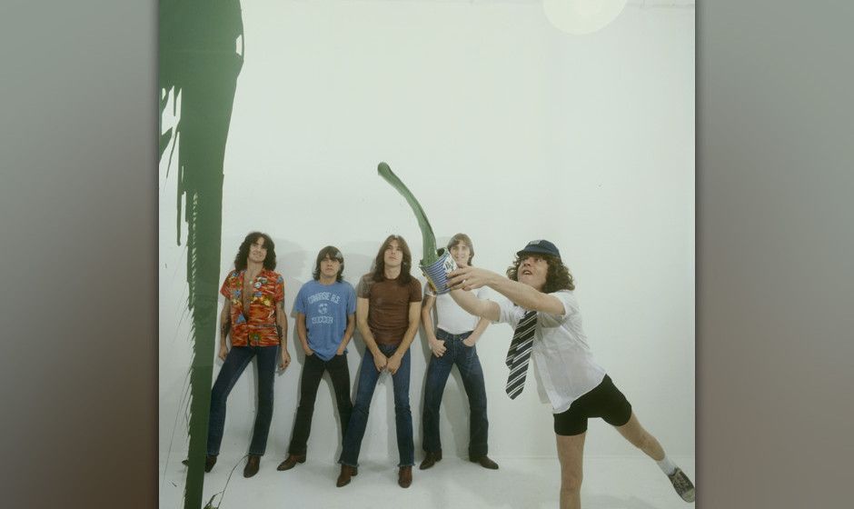 LONDON, UNITED KINGDOM - AUGUST 01: (left to right) Bon Scott, Malcolm Young, Cliff Williams, Phil Rudd and Angus Young of Au