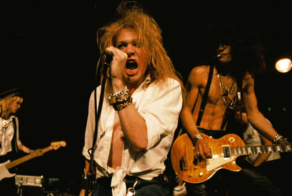 LOS ANGELES - SEPTEMBER 28:  (L-R) Duff McKagan, Axl Rose and Slash of the rock group 'Guns n' Roses' perform at the LA Stree
