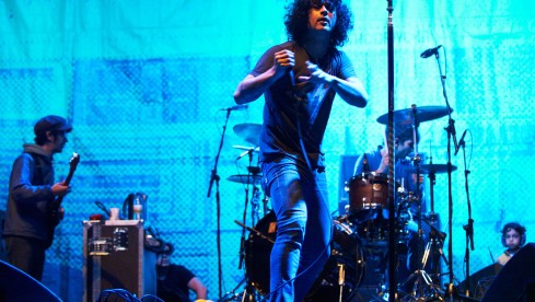 LEEDS, UNITED KINGDOM - AUGUST 26: Omar Rodriguez-Lopez, Cedric Bixler-Zavala and Tony Hajjar of At the Drive-In performs on stage during the final day of Leeds Festival at Bramham Park on August 26, 2012 in Leeds, United Kingdom. (Photo by Gary Wolstenholme/Redferns via Getty Images)
