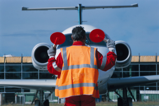 Airport Worker Signalling