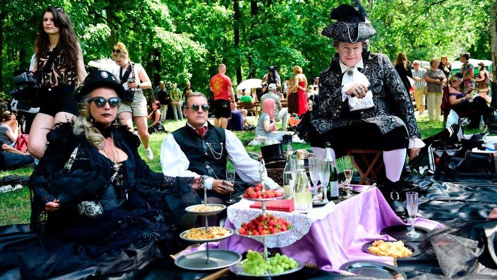Dressed up people attend a so-called 'Victorian Picnic' during the Wave-Gotik-Treffen (WGT) festival in Leipzig, eastern Germ