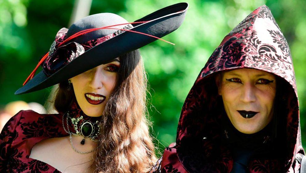 Dressed up people attend a so-called 'Victorian Picnic' during the Wave-Gotik-Treffen (WGT) festival in Leipzig, eastern Germ