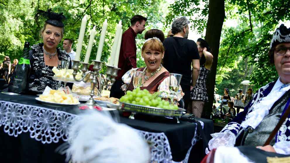 Dressed up people attend a so-called 'Victorian Picnic' during the Wave-Gotik-Treffen (WGT) festival in Leipzig, eastern Germ