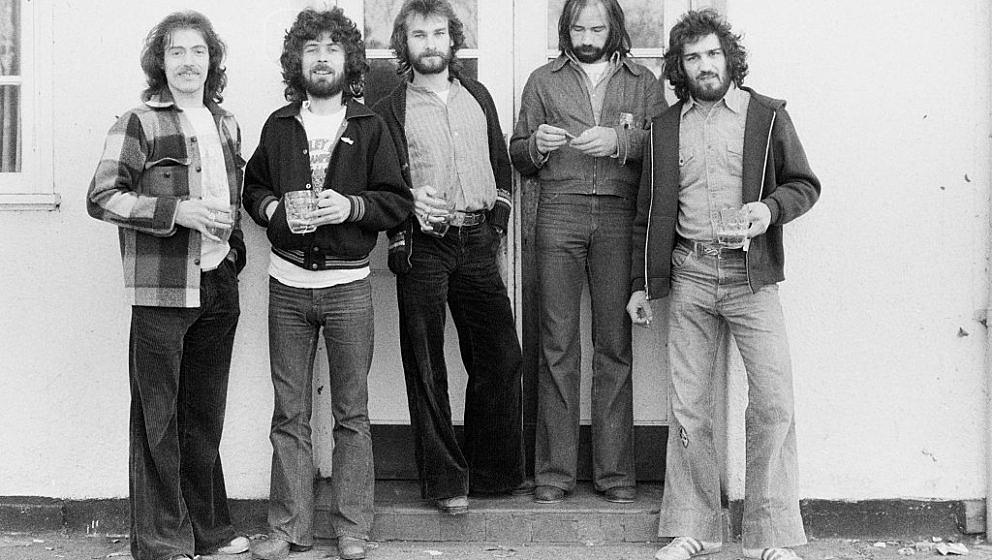 British rock group, Ace outside a pub, 29th, October 1975. Left to right: bassist Tex Comer, guitarist Phil Harris, singer an